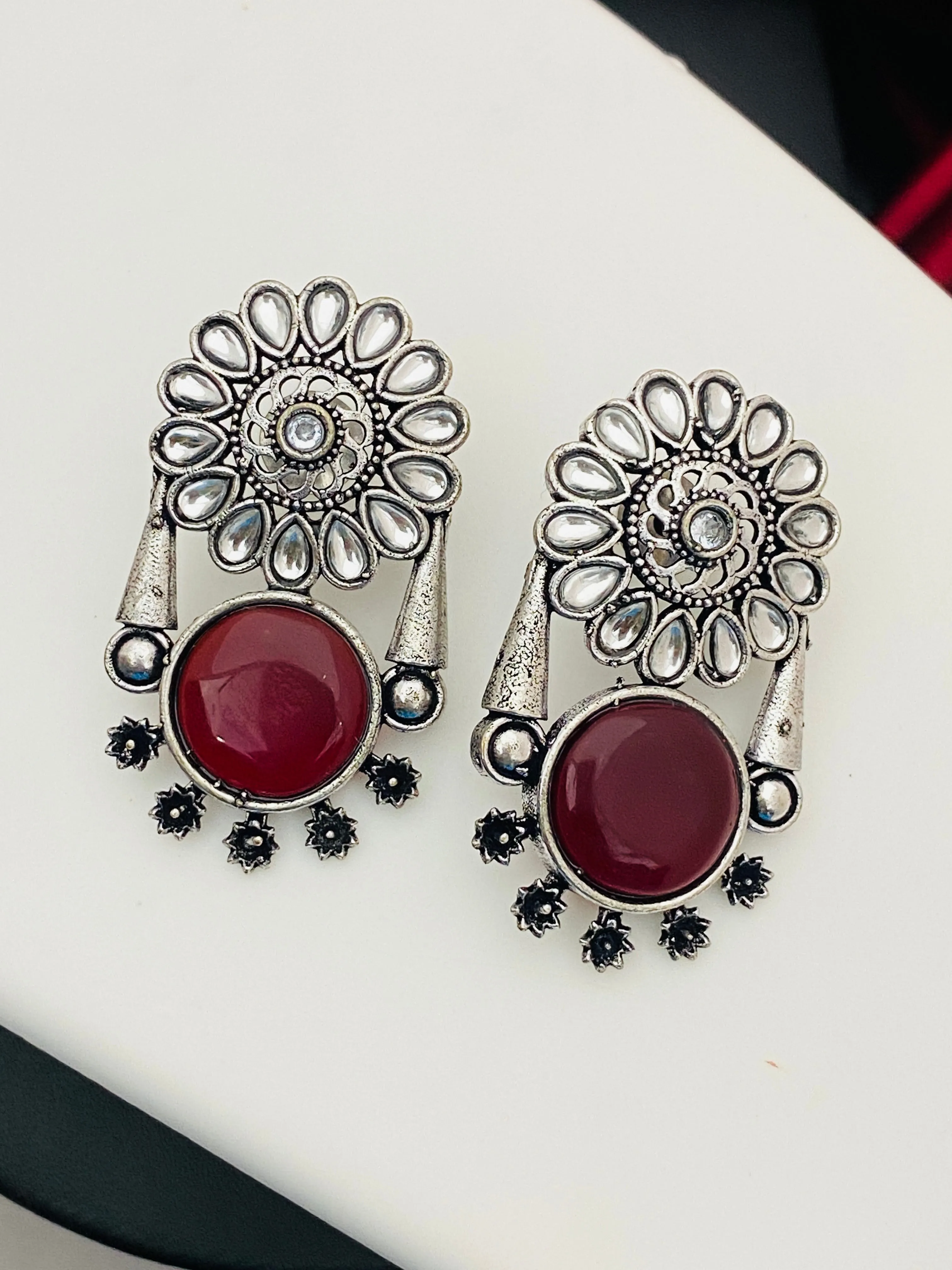 Alluring Maroon Color Oxidized Floral And Round Designed Earrings