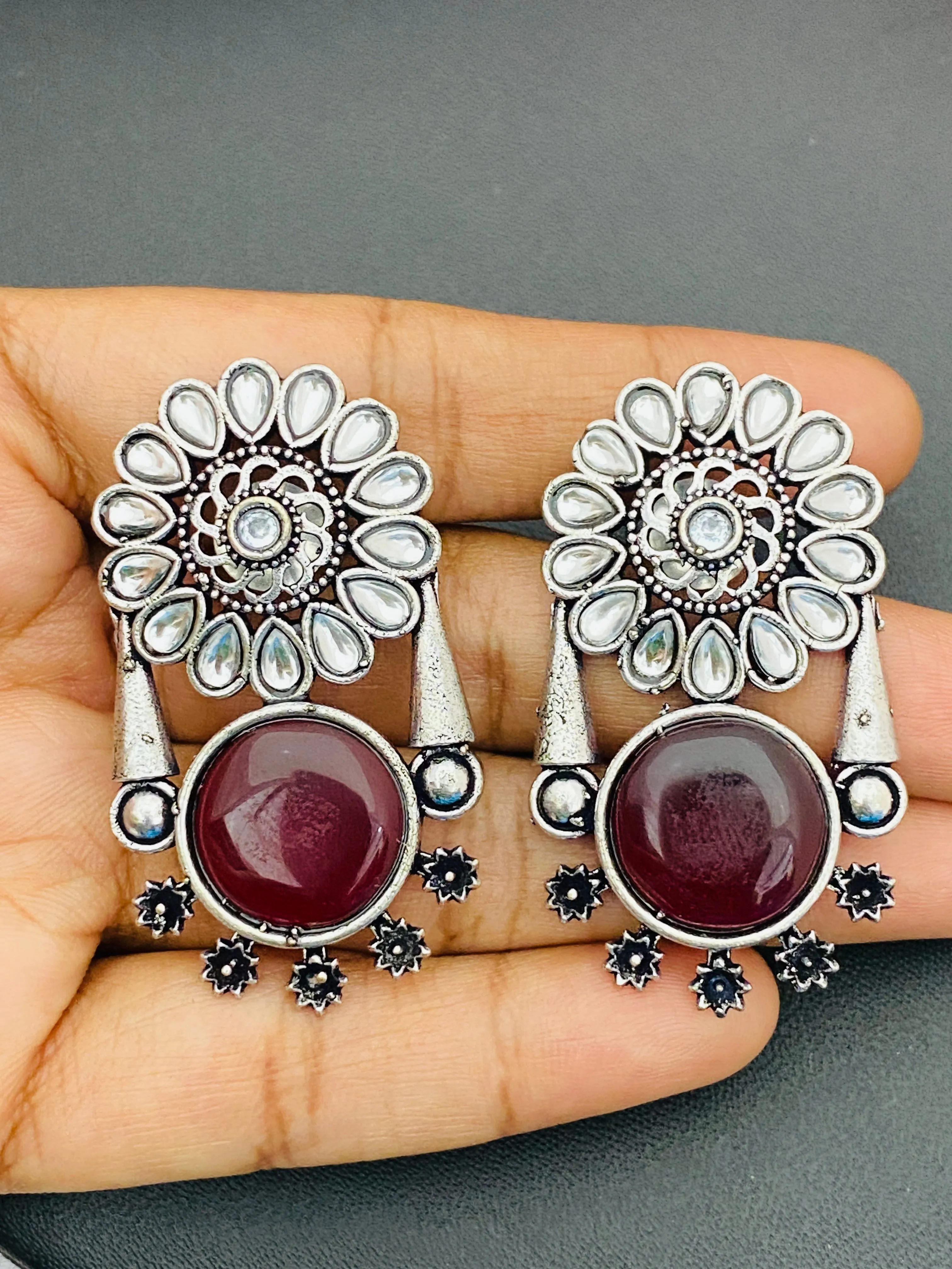 Alluring Maroon Color Oxidized Floral And Round Designed Earrings