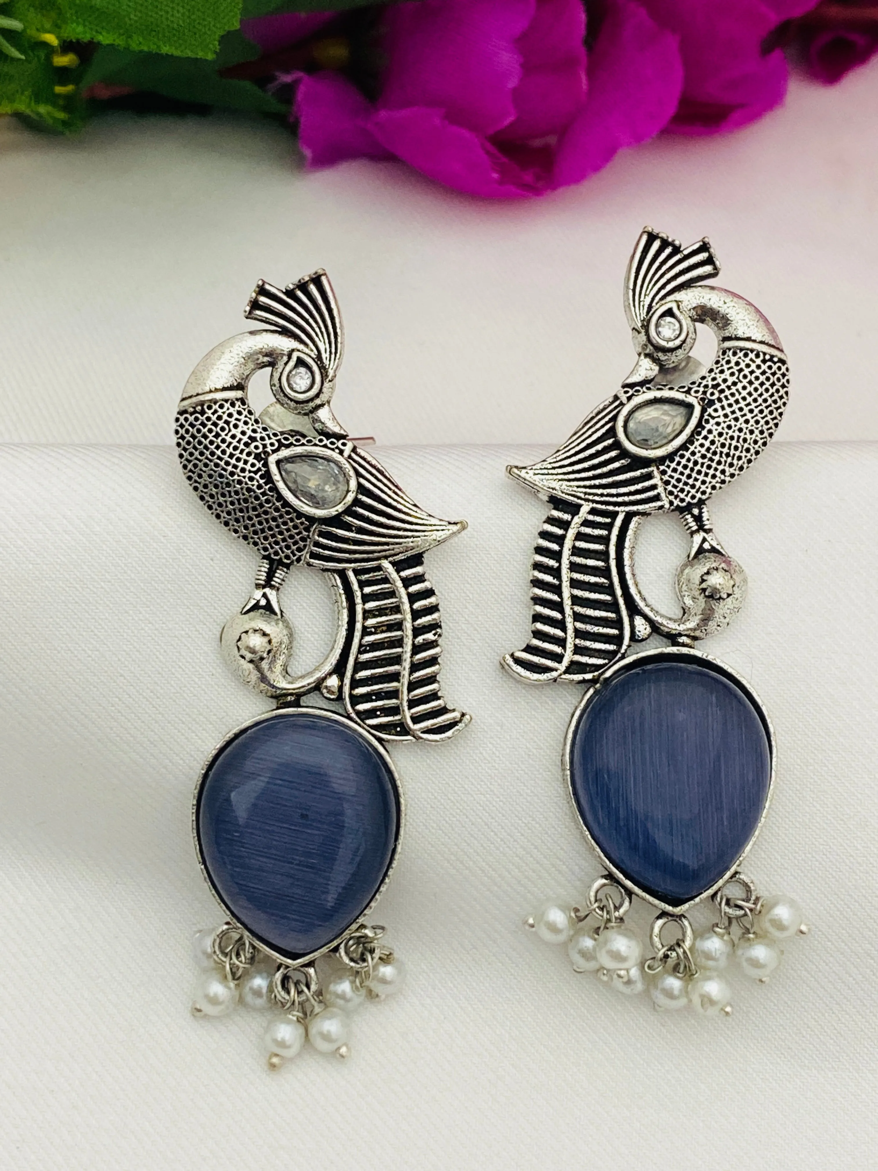 Elegant Blue Stoned Peacock Design Silver Toned Oxidized Earrings With Pearl Beads