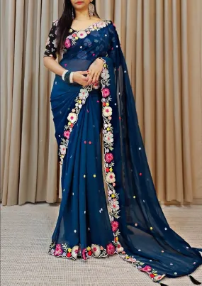 Elegant Teal Blue Colored Floral Designed Georgette Saree For Women